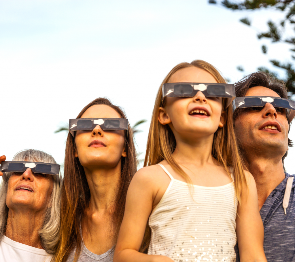 A family watching a solar eclipse